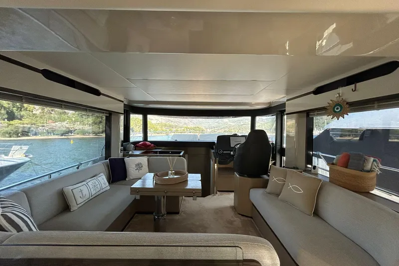 48 Navetta Yacht Photos Pics Luxurious interior of 2019 Absolute NAVETTA 48 yacht with elegant seating and decor.