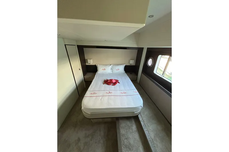 48 Navetta Yacht Photos Pics Luxurious bedroom interior of 2019 Absolute NAVETTA 48 yacht with elegant bedding.