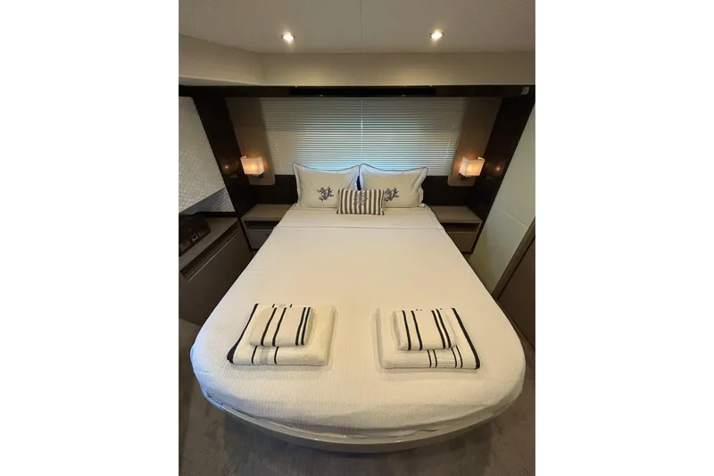48 Navetta Yacht Photos Pics Luxurious bedroom interior of 2019 Absolute NAVETTA 48 yacht with elegant bedding.