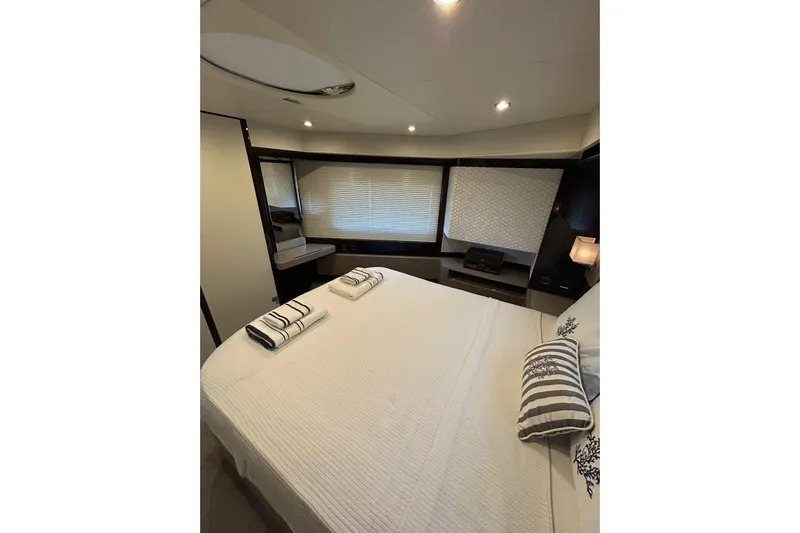 48 Navetta Yacht Photos Pics Luxurious bedroom interior of 2019 Absolute NAVETTA 48 yacht with elegant decor.