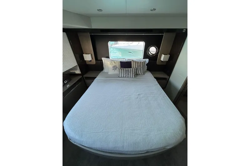 48 Navetta Yacht Photos Pics Luxurious bedroom interior of 2019 Absolute NAVETTA 48 yacht with elegant bedding.