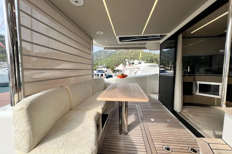 48 Navetta Yacht Photos Pics Luxurious 2019 Absolute NAVETTA 48 yacht interior with elegant seating and wooden table.
