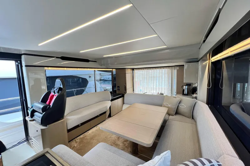 48 Navetta Yacht Photos Pics Luxurious interior of 2019 Absolute NAVETTA 48 yacht with modern seating and elegant decor.