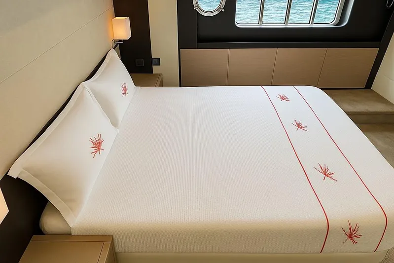 48 Navetta Yacht Photos Pics Luxurious bedroom interior on 2019 Absolute NAVETTA 48 yacht with elegant bedding and ocean view.