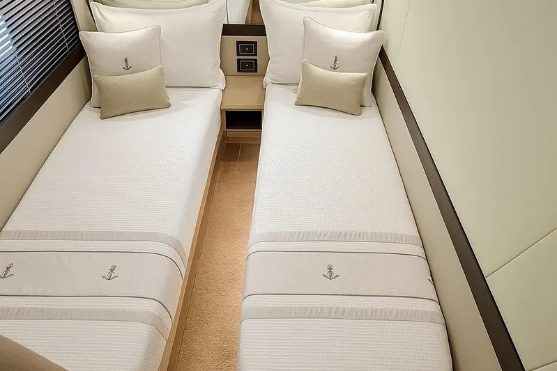 48 Navetta Yacht Photos Pics Luxurious twin cabin in 2019 Absolute NAVETTA 48 yacht, featuring elegant bedding and decor.