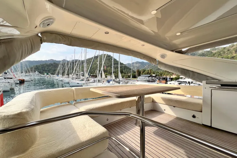 48 Navetta Yacht Photos Pics Luxurious 2019 Absolute NAVETTA 48 yacht interior with marina view and elegant seating area.