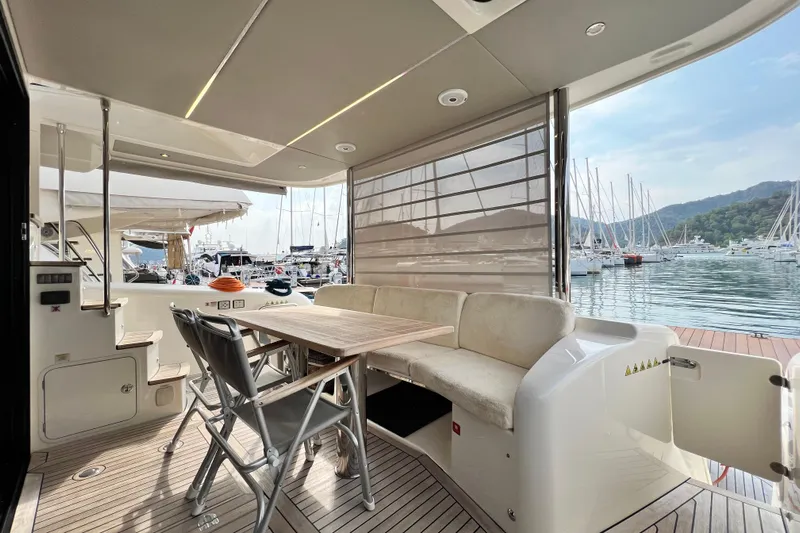 48 Navetta Yacht Photos Pics Luxurious 2019 Absolute NAVETTA 48 yacht interior with marina view and elegant seating area.