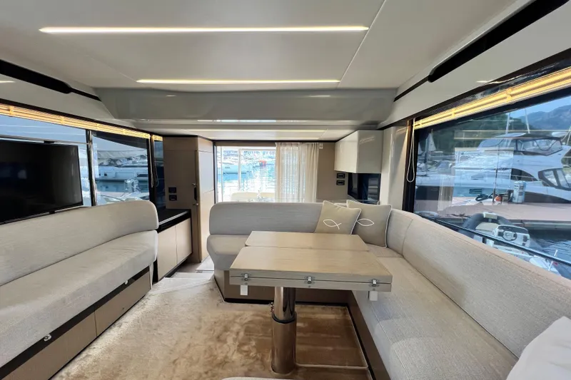 48 Navetta Yacht Photos Pics Luxurious interior of 2019 Absolute NAVETTA 48 yacht with elegant seating and modern design.