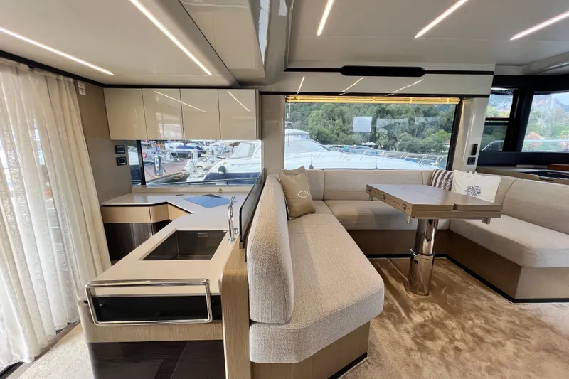 48 Navetta Yacht Photos Pics Luxurious interior of 2019 Absolute NAVETTA 48 yacht with modern seating and elegant design.