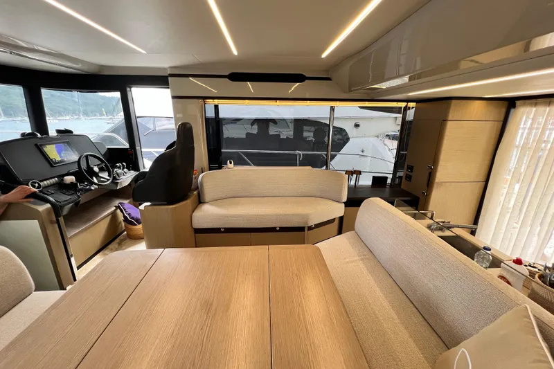 48 Navetta Yacht Photos Pics Interior of 2019 Absolute NAVETTA 48 yacht, featuring modern seating and navigation area.