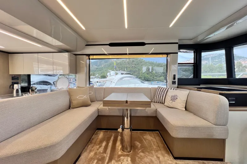 48 Navetta Yacht Photos Pics Luxurious interior of 2019 Absolute NAVETTA 48 yacht with elegant seating and modern design.