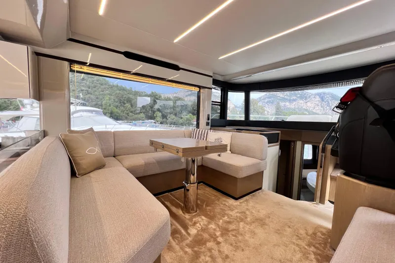 48 Navetta Yacht Photos Pics Luxurious interior of 2019 Absolute NAVETTA 48 yacht with plush seating and scenic views.