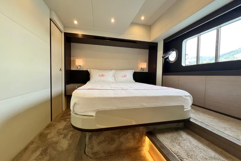 48 Navetta Yacht Photos Pics Luxurious bedroom interior of 2019 Absolute NAVETTA 48 yacht with modern design and large window.