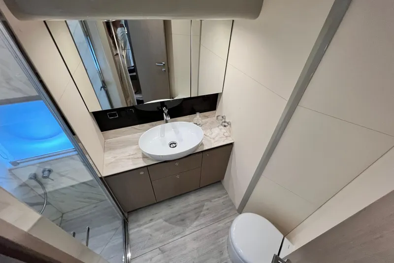 48 Navetta Yacht Photos Pics Luxurious bathroom interior of 2019 Absolute NAVETTA 48 yacht, featuring modern sink and elegant design.
