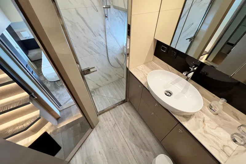 48 Navetta Yacht Photos Pics Luxurious bathroom in 2019 Absolute NAVETTA 48 yacht with modern fixtures and marble accents.