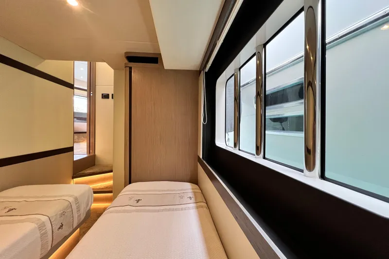 48 Navetta Yacht Photos Pics Interior of 2019 Absolute NAVETTA 48 yacht with twin beds and large windows.