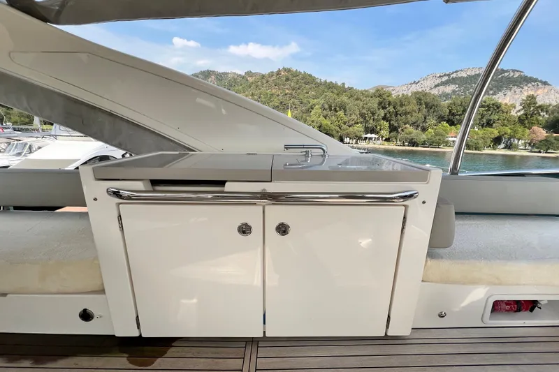 48 Navetta Yacht Photos Pics Outdoor kitchenette on 2019 Absolute NAVETTA 48 yacht with scenic background.