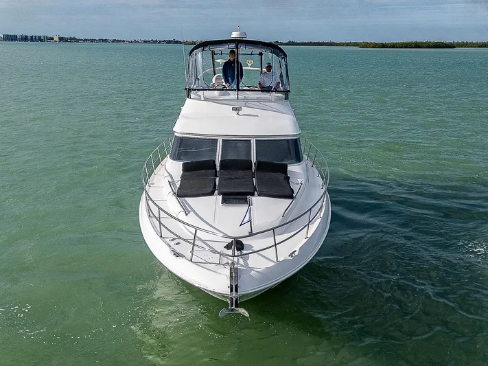 Feliz Dream Yacht Photos Pics 2001 Sea Ray 400 Sedan Bridge yacht cruising on calm waters.