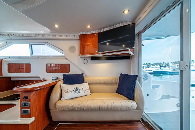 Feliz Dream Yacht Photos Pics Interior of 2001 Sea Ray 400 Sedan Bridge yacht with sofa and TV.
