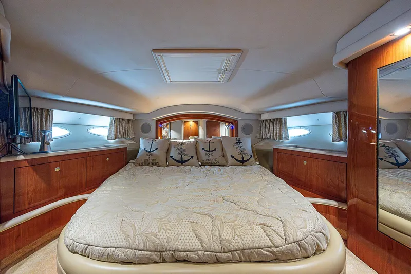 Feliz Dream Yacht Photos Pics Luxurious bedroom interior of 2001 Sea Ray 400 Sedan Bridge yacht.
