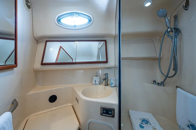 Feliz Dream Yacht Photos Pics 2001 Sea Ray 400 Sedan Bridge bathroom with shower, sink, and mirror.