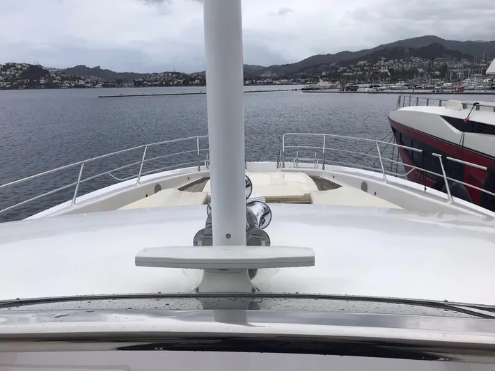 Melissa Yacht Photos Pics Front deck view of a 2011 Sunseeker 34 Metre Yacht in a marina.