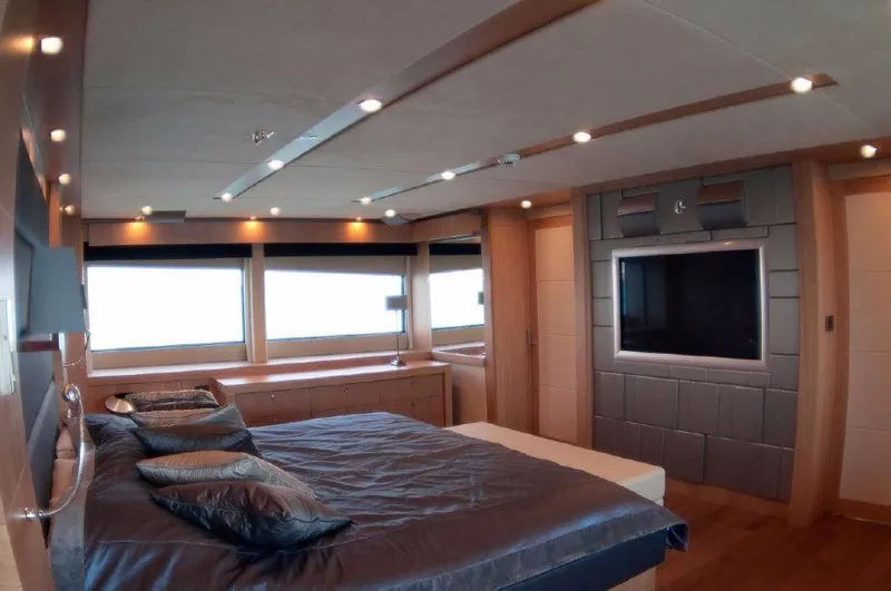 Melissa Yacht Photos Pics Luxurious bedroom interior of 2011 Sunseeker 34 Metre Yacht with modern design and large windows.