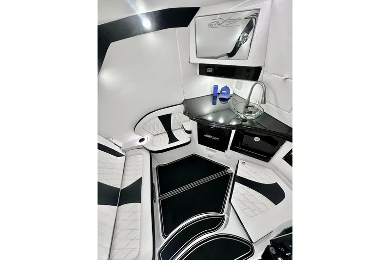  Yacht Photos Pics Luxurious interior of 2024 MTI V42 boat with sleek black and white design.