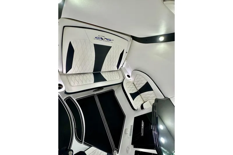  Yacht Photos Pics Luxurious interior of 2024 MTI V42 boat with quilted seating and modern design.