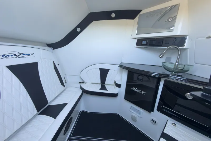  Yacht Photos Pics Luxurious interior of 2024 MTI V42 boat with sleek seating and modern amenities.