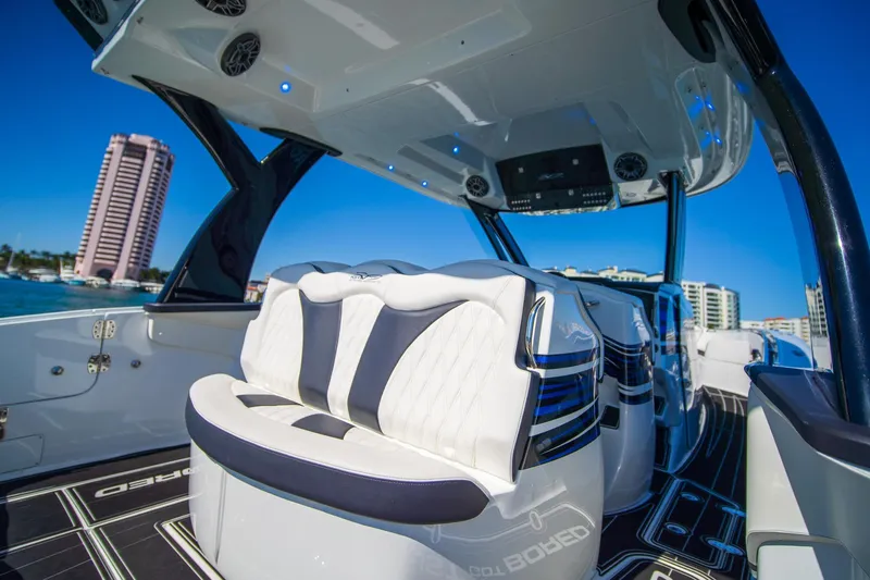  Yacht Photos Pics 2024 MTI V42 luxury boat interior with modern seating and sleek design.