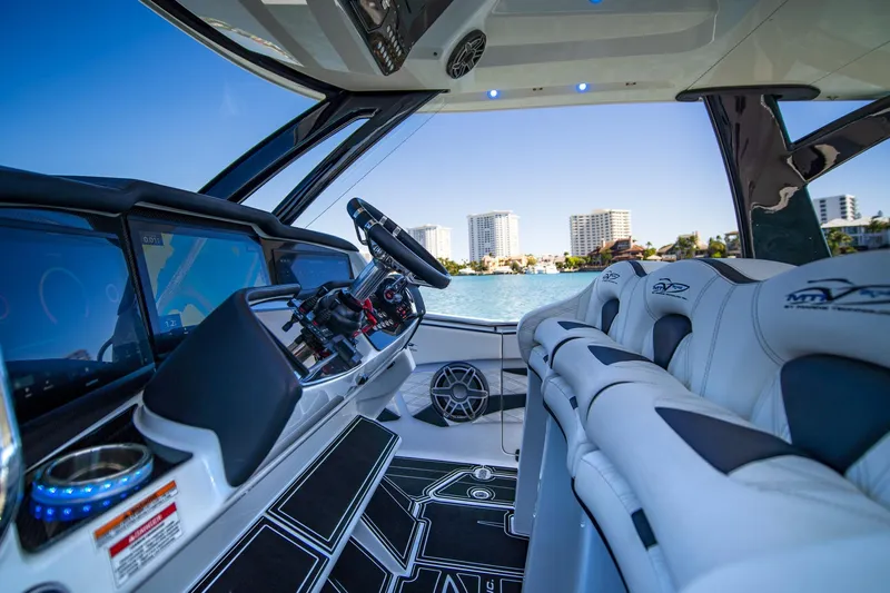  Yacht Photos Pics Interior of 2024 MTI V42 boat with modern dashboard and luxury seating.
