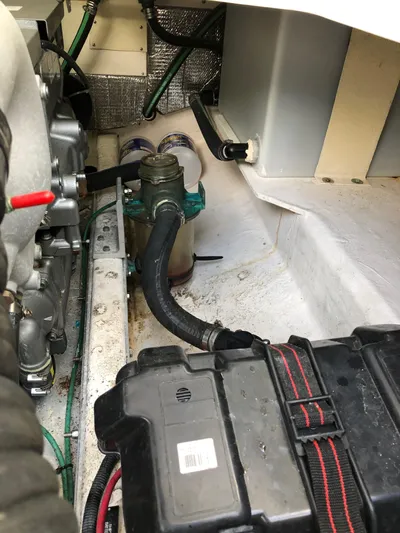 Act III Yacht Photos Pics Engine compartment of a 2008 Back Cove 29 boat, showing mechanical components and wiring.