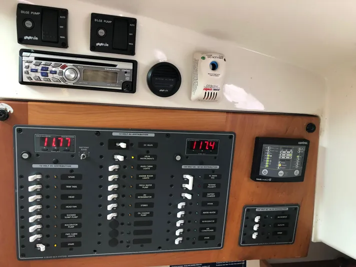 Act III Yacht Photos Pics Electrical control panel on a 2008 Back Cove 29 boat, featuring switches and gauges.