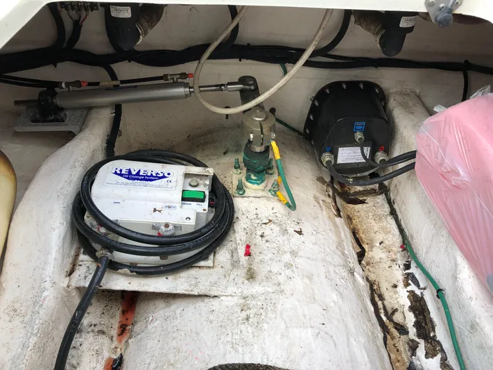 Act III Yacht Photos Pics Engine compartment of a 2008 Back Cove 29 boat, featuring mechanical components and wiring.