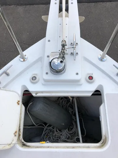 Act III Yacht Photos Pics 2008 Back Cove 29 boat deck with open storage compartment and marine equipment.