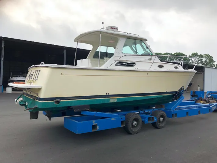 Act III Yacht Photos Pics 2008 Back Cove 29 boat on trailer in a marina setting.