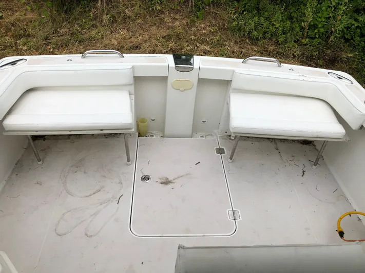 Act III Yacht Photos Pics 2008 Back Cove 29 boat interior with white seating and storage compartments.