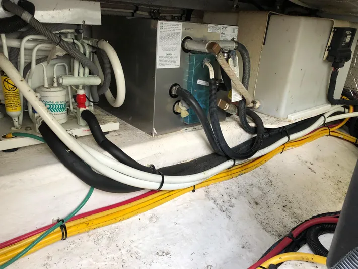 Act III Yacht Photos Pics Engine compartment of a 2008 Back Cove 29 boat, showing wiring and mechanical components.