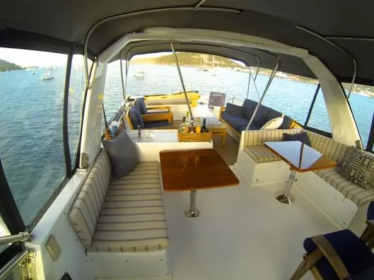 Mcgregor III Yacht Photos Pics Spacious deck of 2001 Jefferson Marquessa 60 MY yacht with seating and tables.