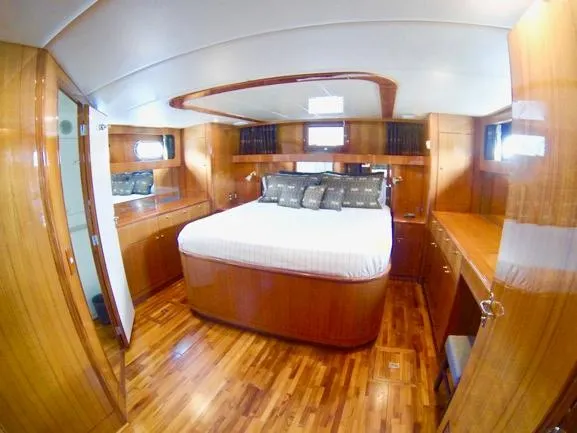 Mcgregor III Yacht Photos Pics Luxurious cabin interior of 2001 Jefferson Marquessa 60 MY yacht with wood finish.