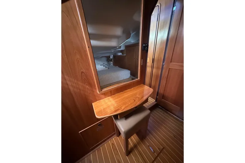 True North Yacht Photos Pics Interior of 2003 Catalina 470 yacht with wooden vanity and mirror.