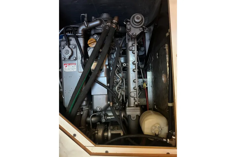True North Yacht Photos Pics Engine compartment of a 2003 Catalina 470 sailboat, showcasing mechanical components.