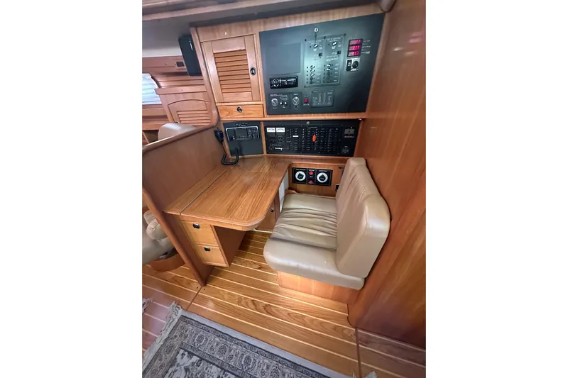 True North Yacht Photos Pics Interior of 2003 Catalina 470 yacht with navigation station and control panel.