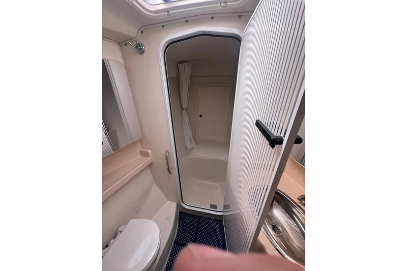 True North Yacht Photos Pics Bathroom interior of a 2003 Catalina 470 yacht, featuring shower and sink.