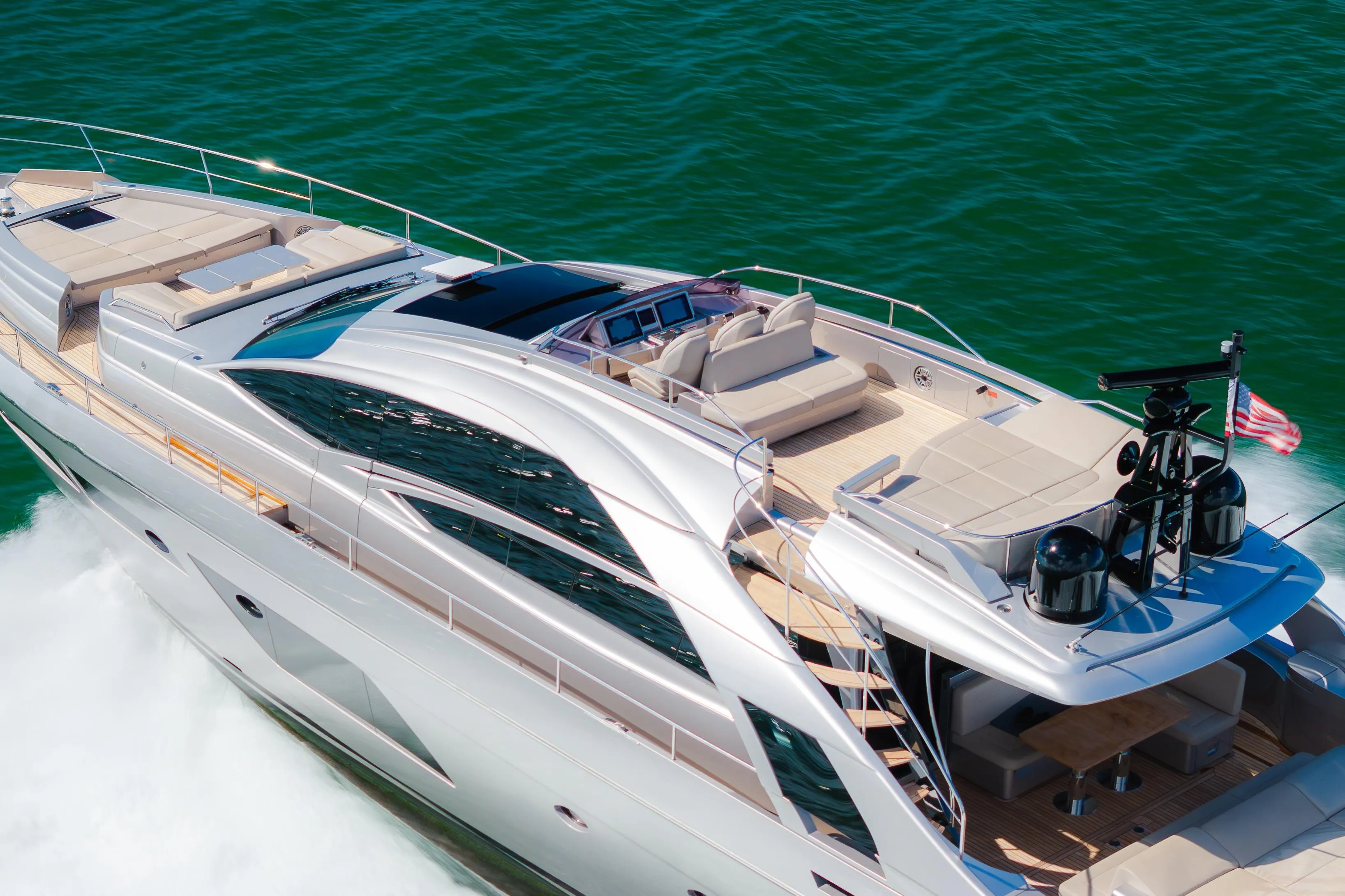 Luxurious 2021 Pershing 8X yacht cruising on vibrant blue waters.