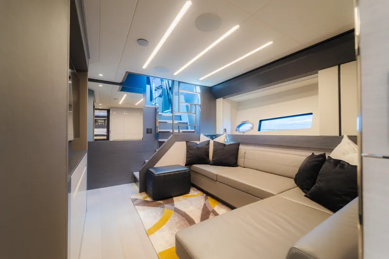 Nova Yacht Photos Pics Luxurious interior of 2021 Pershing 8X yacht with modern seating and elegant lighting.