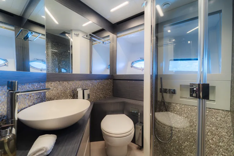 Nova Yacht Photos Pics Luxurious bathroom in 2021 Pershing 8X yacht with modern fixtures and elegant design.