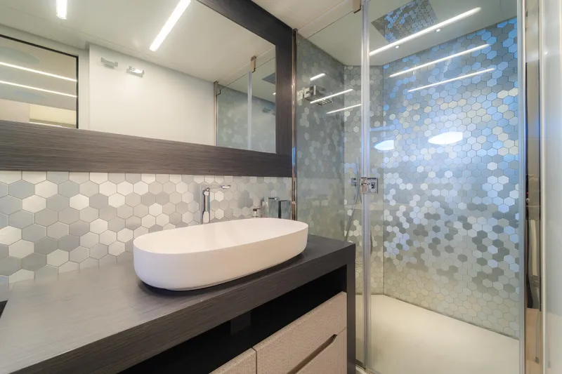 Nova Yacht Photos Pics Modern bathroom in 2021 Pershing 8X yacht with hexagonal tile design.