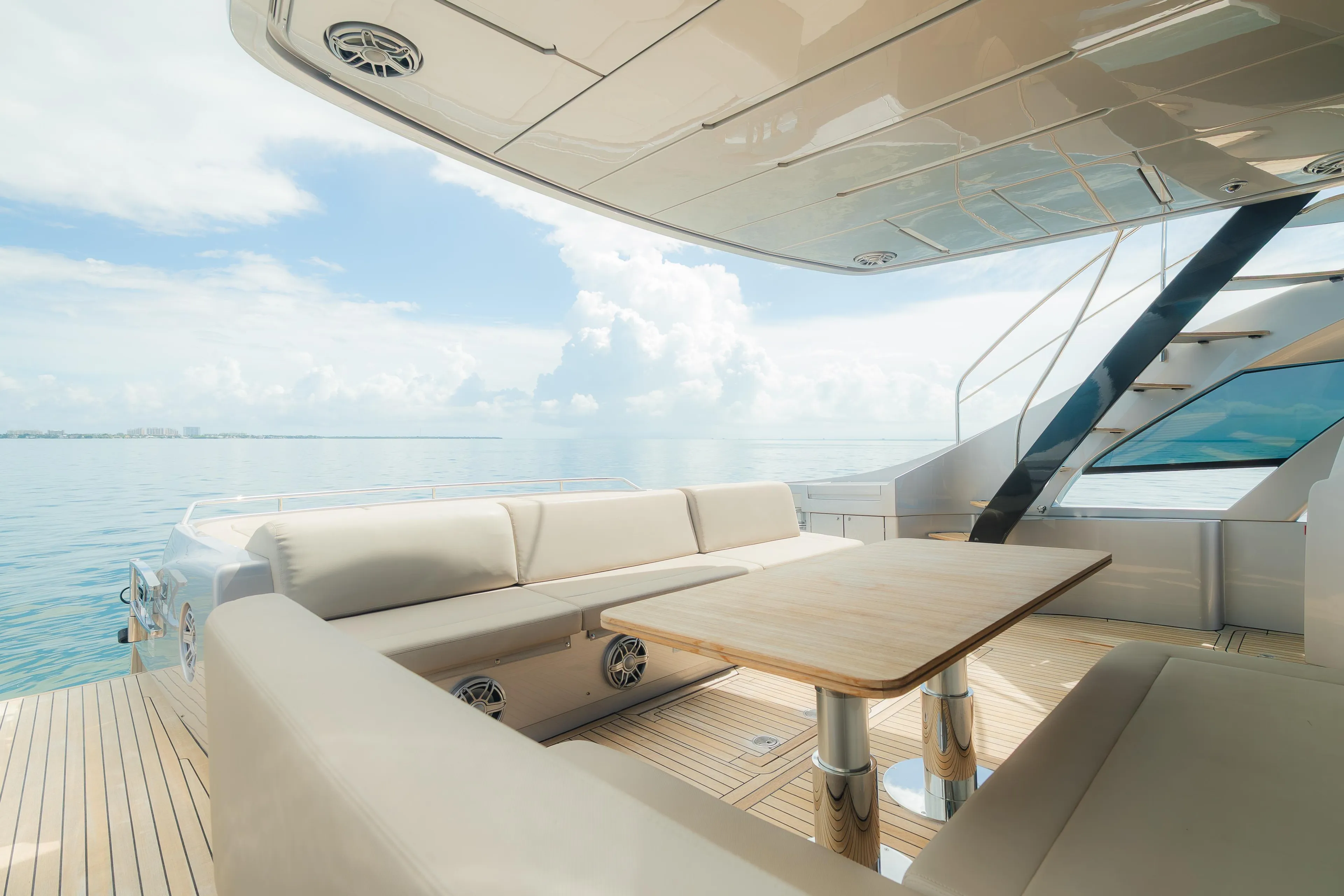 Luxurious 2021 Pershing 8X yacht deck with elegant seating and ocean view.